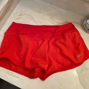Red Nike running shorts